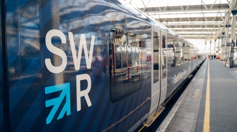 Photo of a blue SWR train on a platform with SWR logo visible