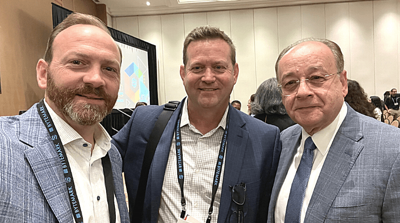 John Walton and John Busskohl standing next to APTA President & CEO Paul Skoutelas