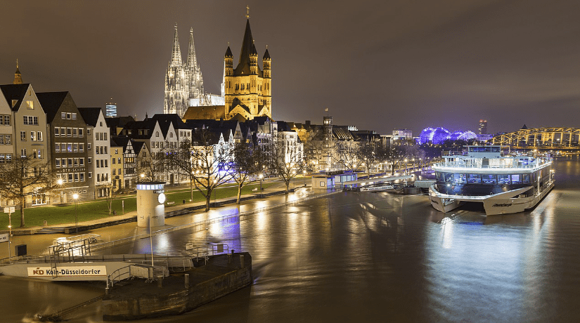 Cologne, Germany at night. By dronepicr - Old town of cologne during the flood in january 2018, CC BY 2.0, https://commons.wikimedia.org/w/index.php?