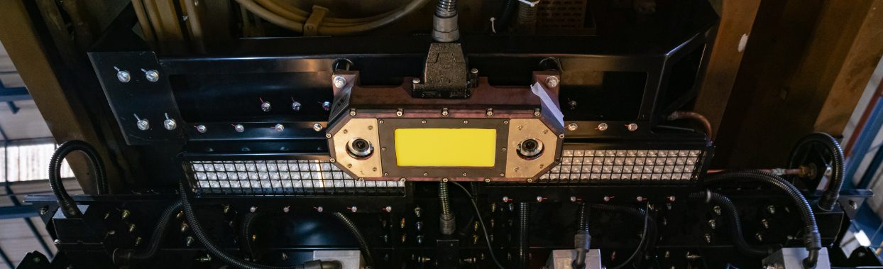 Photograph of a line scan camera installed underneath one of Network Rail's Class 153 Visual Inspection Units