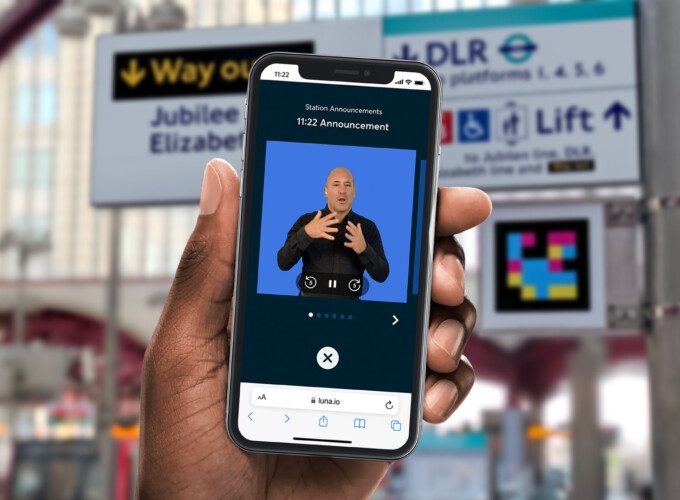 GoMedia's Luna solution providing a virtual sign language avatar on a user's smartphone, in front of transport network signage and a Visor scannable code.