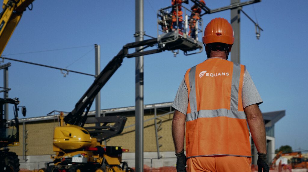 An Equans worker wearing a hi-vis jacket