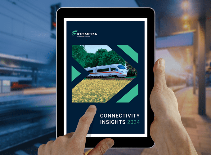 Connectivity insight 1 Hands holding a tablet computer. On the display is the cover of Icomera's Connectivity Insights 2024 report